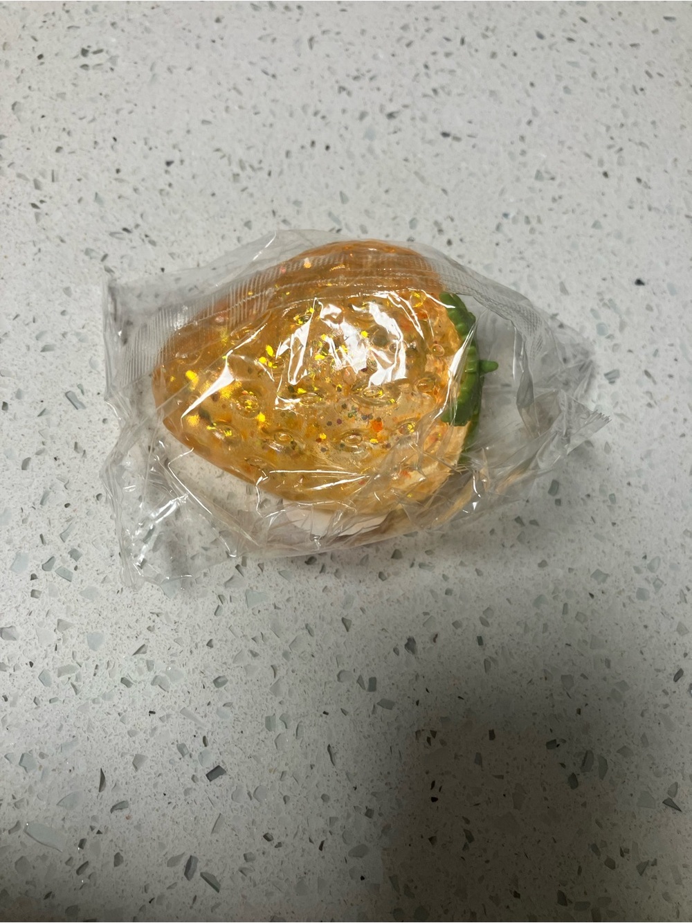 Orange strawberry squishy toy
